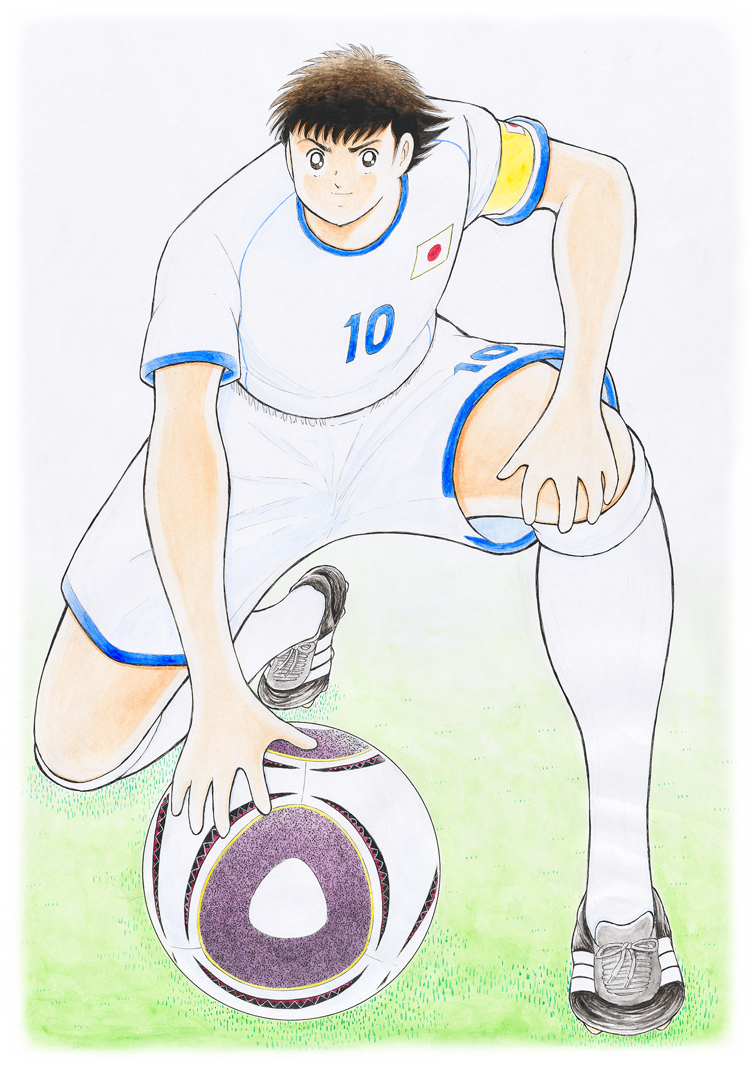 キャプテン翼が、ボールに手を当てて、片足をついて座っている